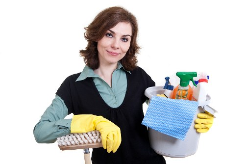 Domestic cleaner working in a Bermondsey kitchen and living area